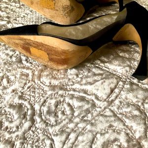 Black Dior suede pumps.